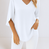 Stylish top with a V-neck and open sleeves