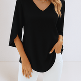 Stylish top with a V-neck and open sleeves