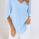 Stylish top with a V-neck and open sleeves